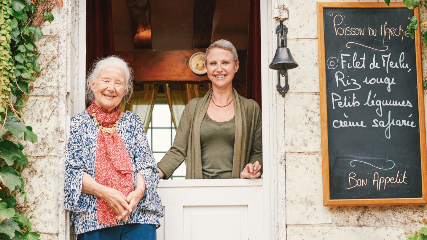 Beatrice Be My Guest host smiling from doorway - responsible travel