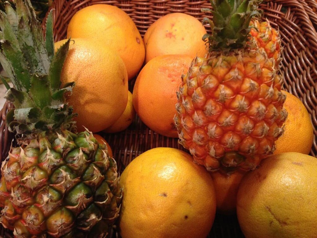 basket of oranges and pineapples food in Tanzania