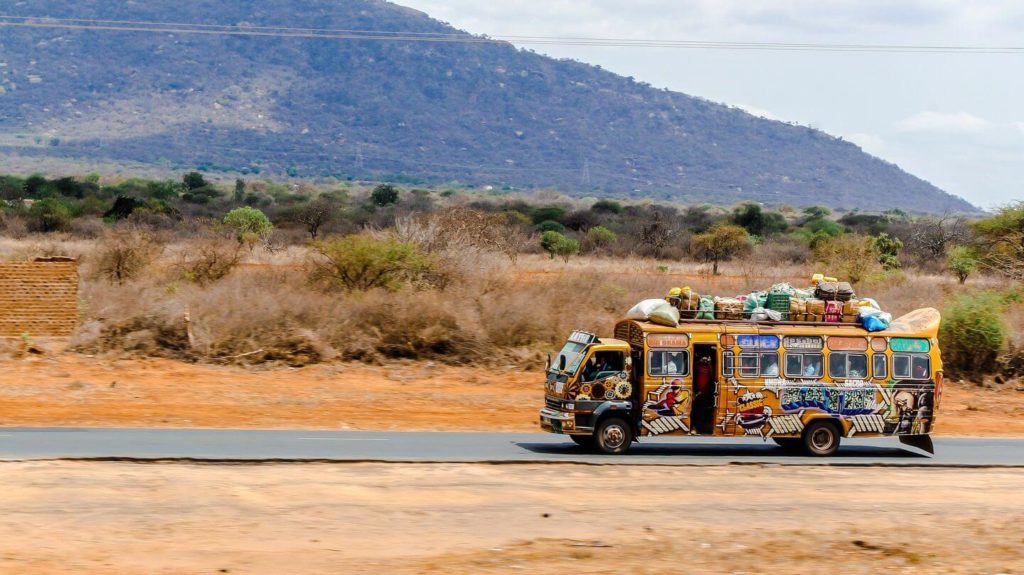 bus driving through countryside Christmas in Kenya