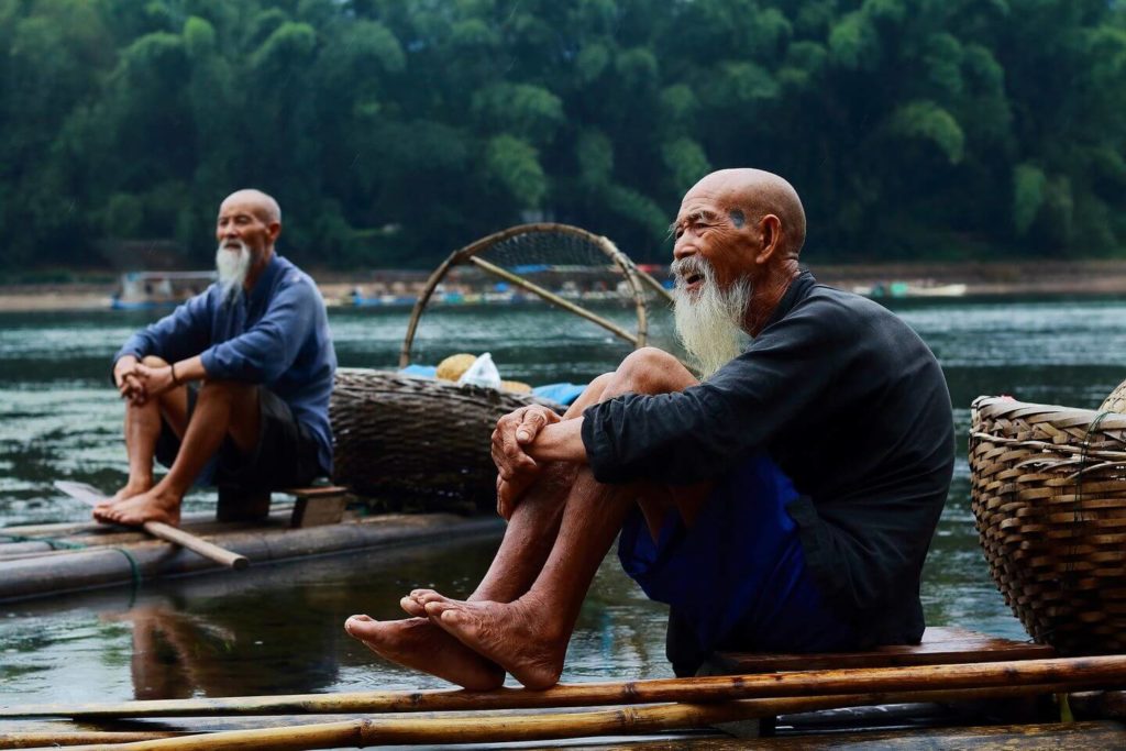 local fishermen with baskets China travel guide