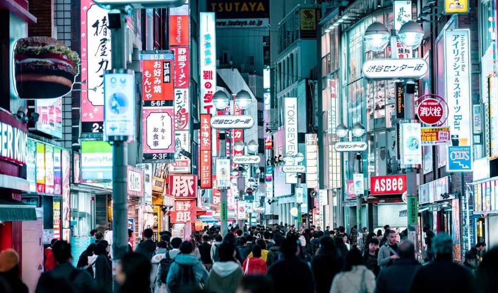 crowds and neon lights of Shibuya district Tokyo