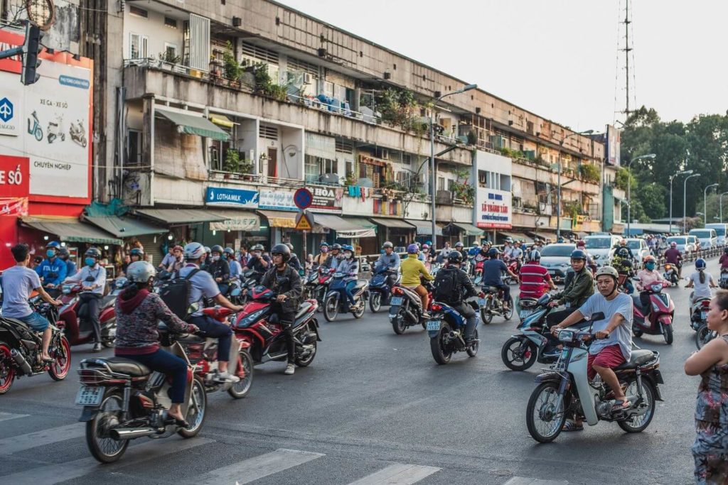 busy traffic in Vietnam crossing the road in Vietnam
