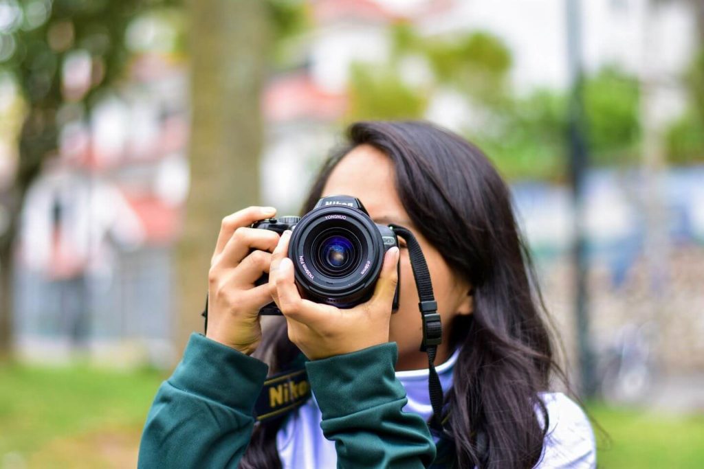 woman taking photos with a camera