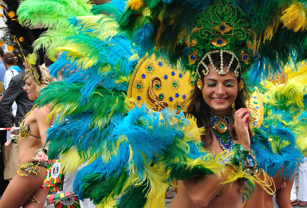 A samba school dancer in a colourful costume performing at Rio Carnival.