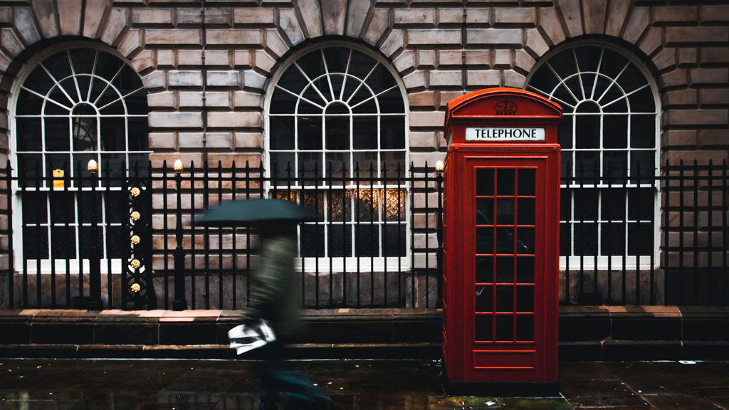 Red phone booth and rainy weather in London