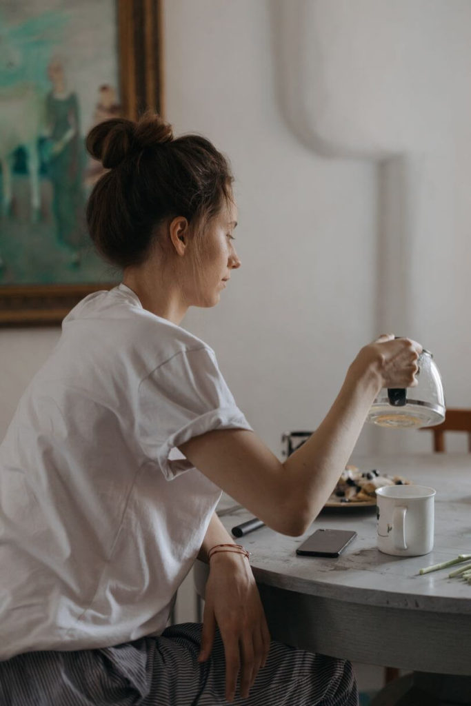 Scandinavian woman pouring a coffee