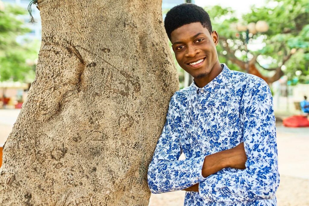 Kenyan man wearing floral button up shirt