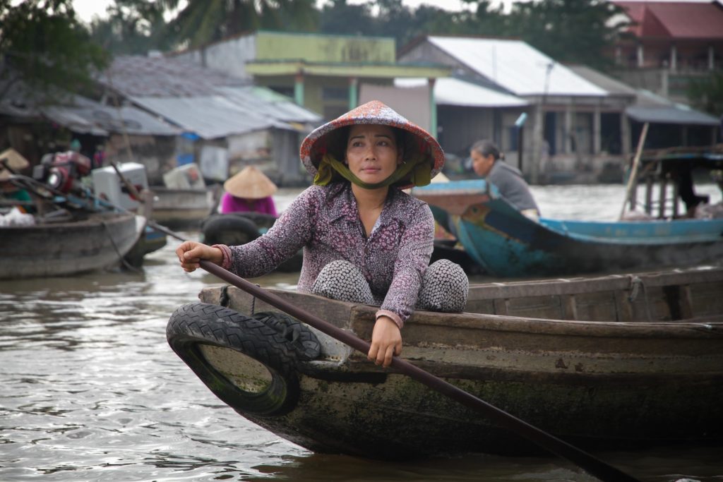 Woman in Vietnam on a boat. 