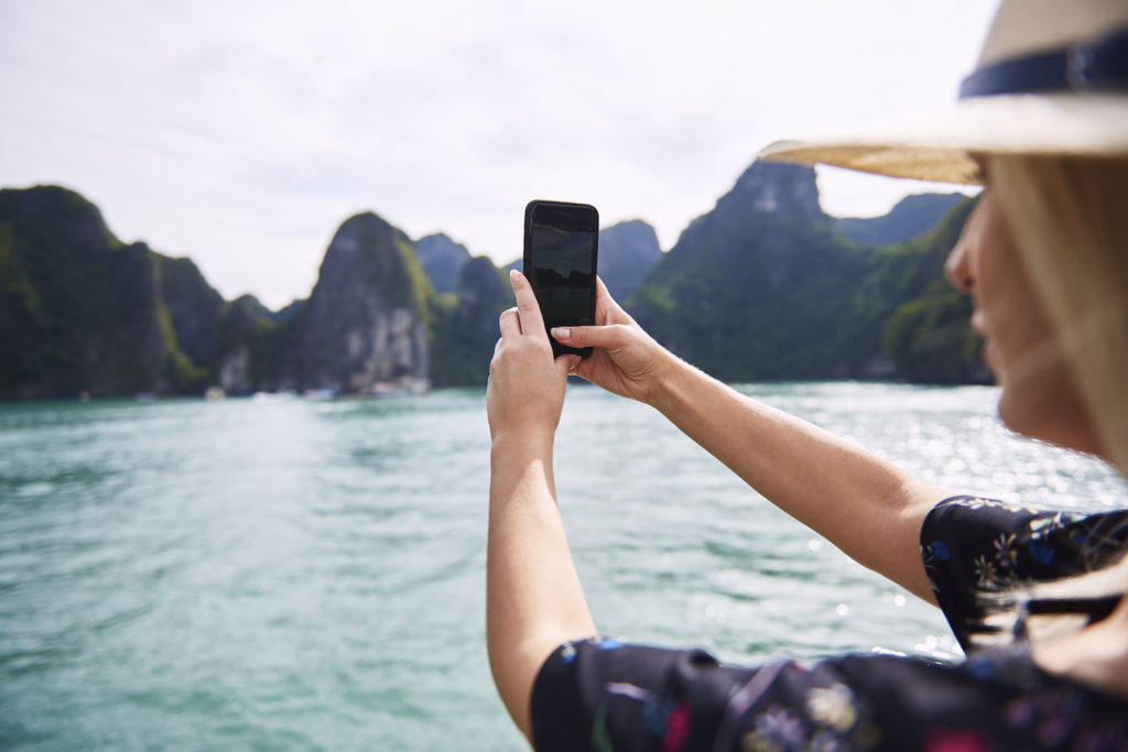 Woman taking photo in Vietnam