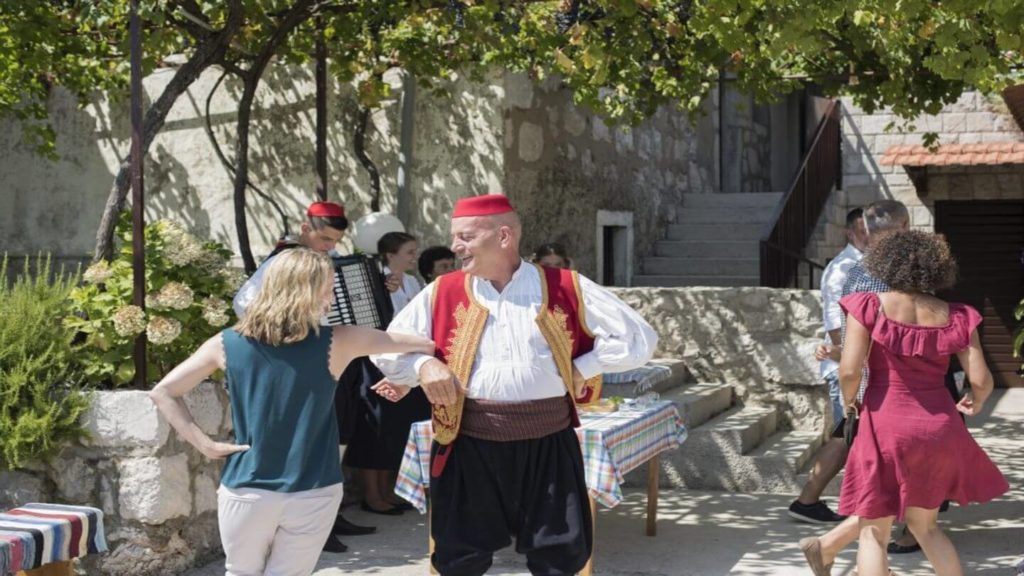 The Muhoberac family teaching folklore dances to Trafalgar guests Croatia