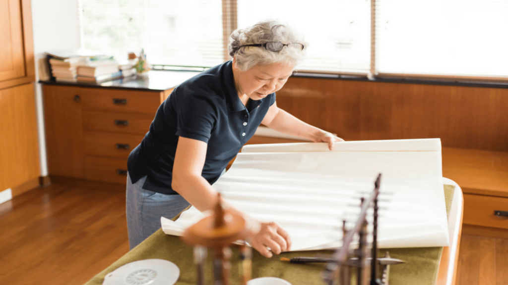 Japanese woman making traditional washi paper