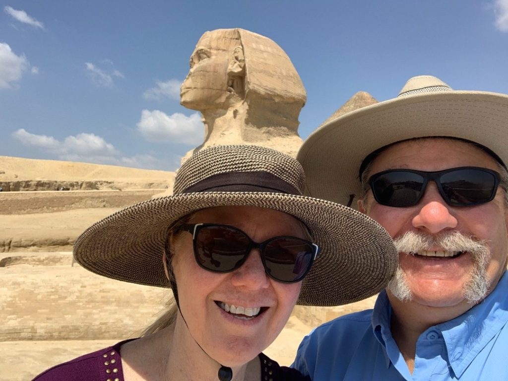 John and Diana Ramsey smiling in front of Egyptian sphinx