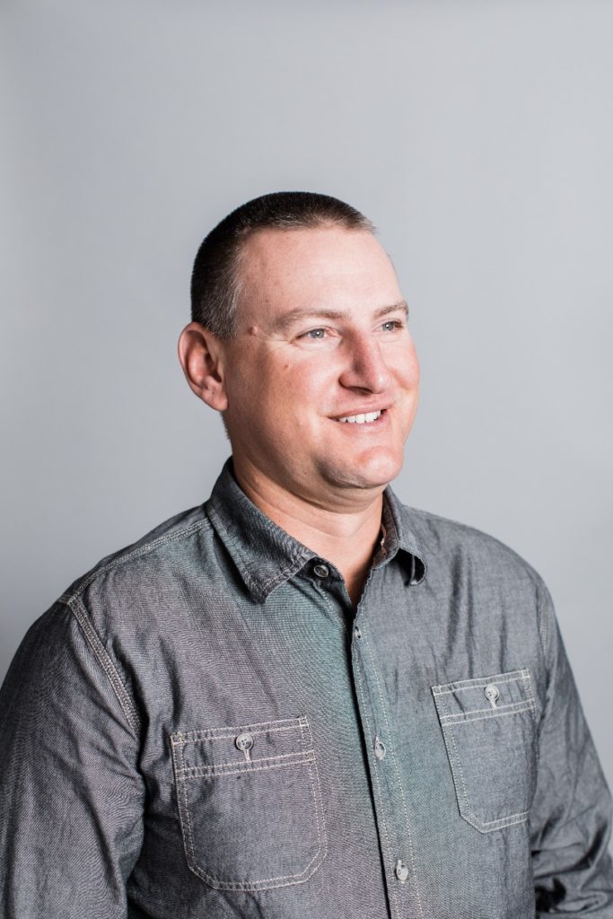 Professional portrait of Travel Director Tyson Whitney