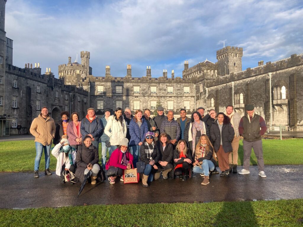 group posing in front of kilkenny castle