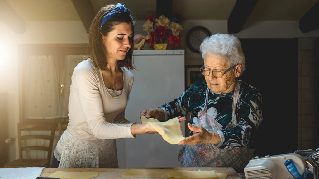 Two ladies making dough
