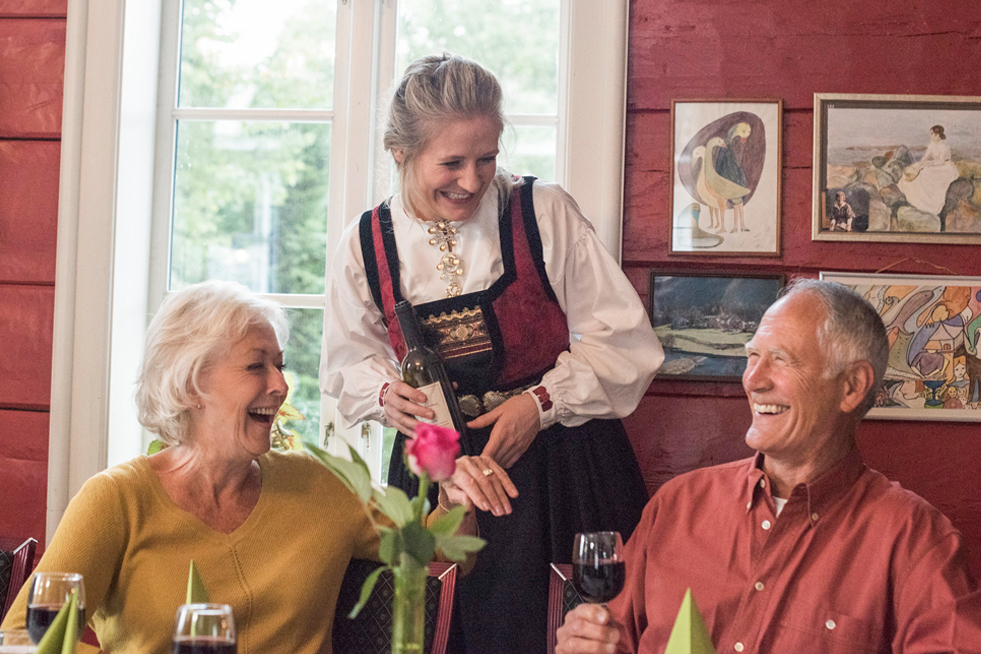 Be My Guest Experience with local serving a couple wine