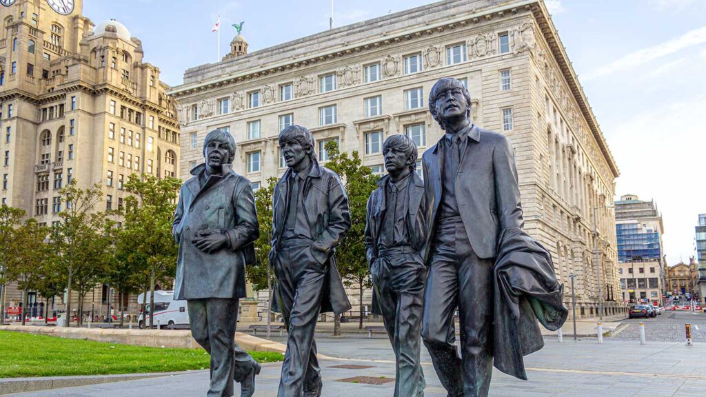 The Cunard Building, behind the Beatles statue, was used as a filming location in the Fantastic Beasts