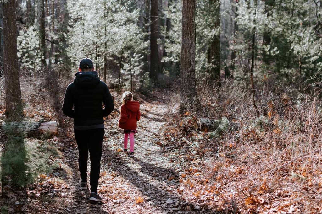 dad and daughter walking in the park
