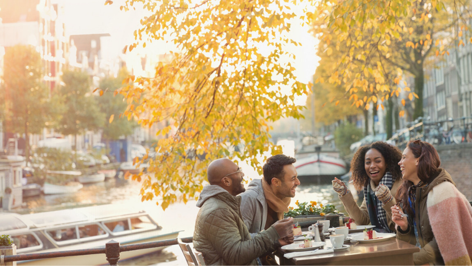 four people enjoying lunch outside