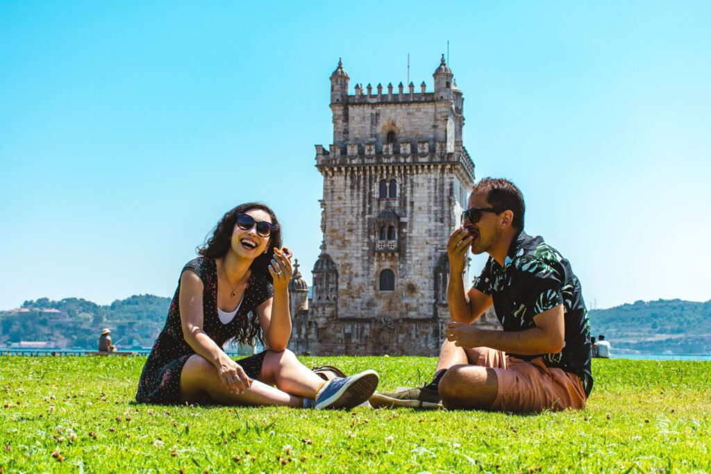 people on grass in portugal snacking