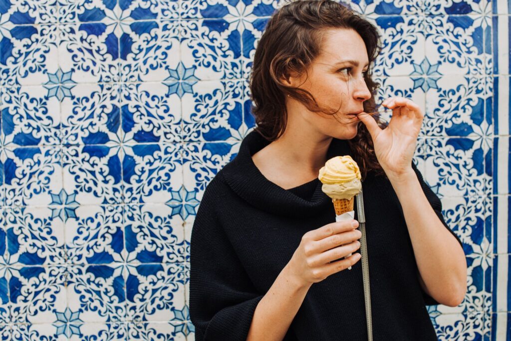 girl eating ice cream in portugal