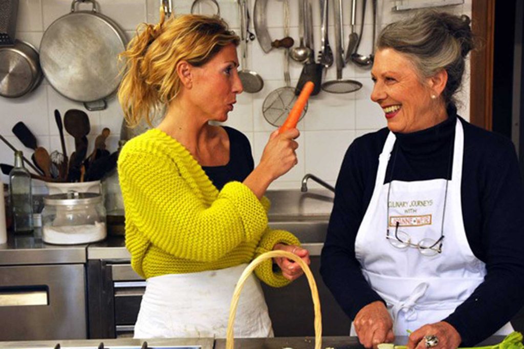 Giada Landi and her mother cooking in the kitchen