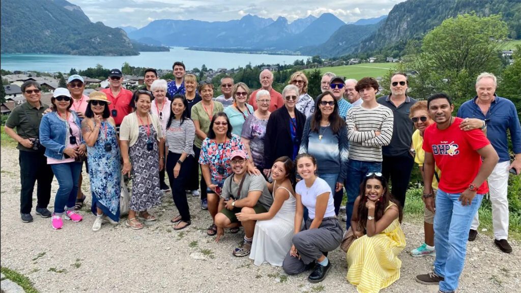 Big Trafalgar group on tour - group photo in front of a lake