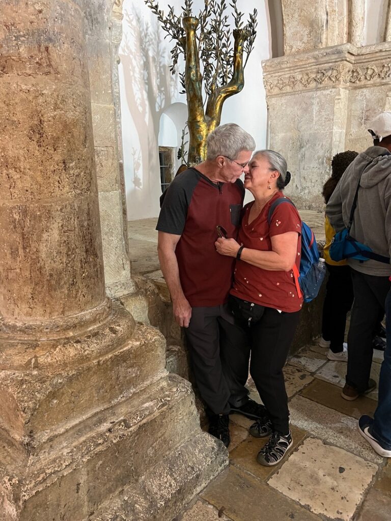 Dolores and husband Jay sharing a kiss