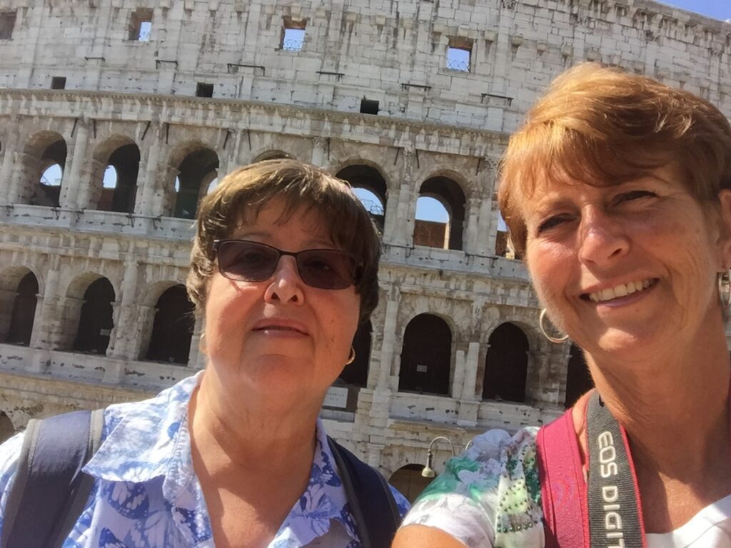 Judy and sister Janet at the Colosseum on Trafalgar Italy trip