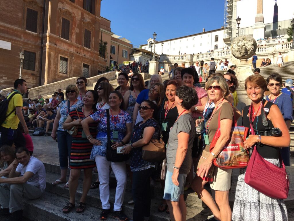 Judy and group at the Spanish Steps in Rome on Trafalgar Italy trip