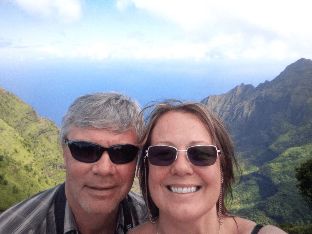 Couple taking a selfie in Hawaii, with sunglasses on
