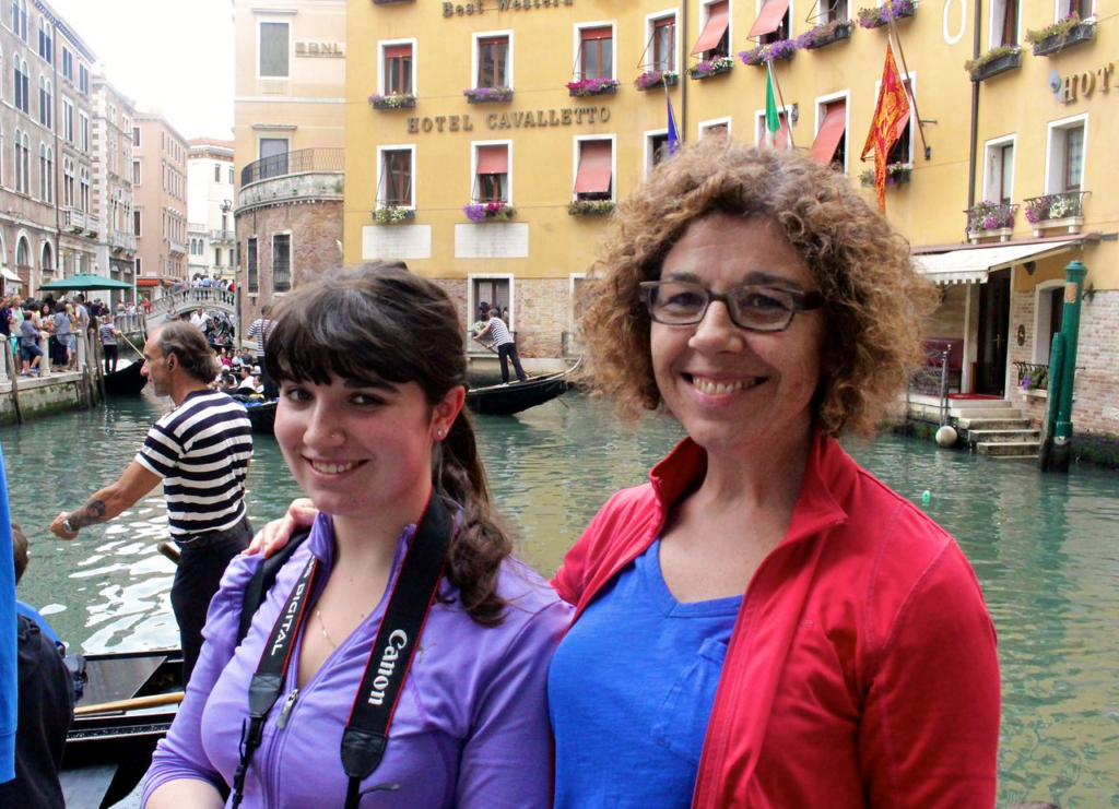 Mother and daughter smiling for a photo in Venice