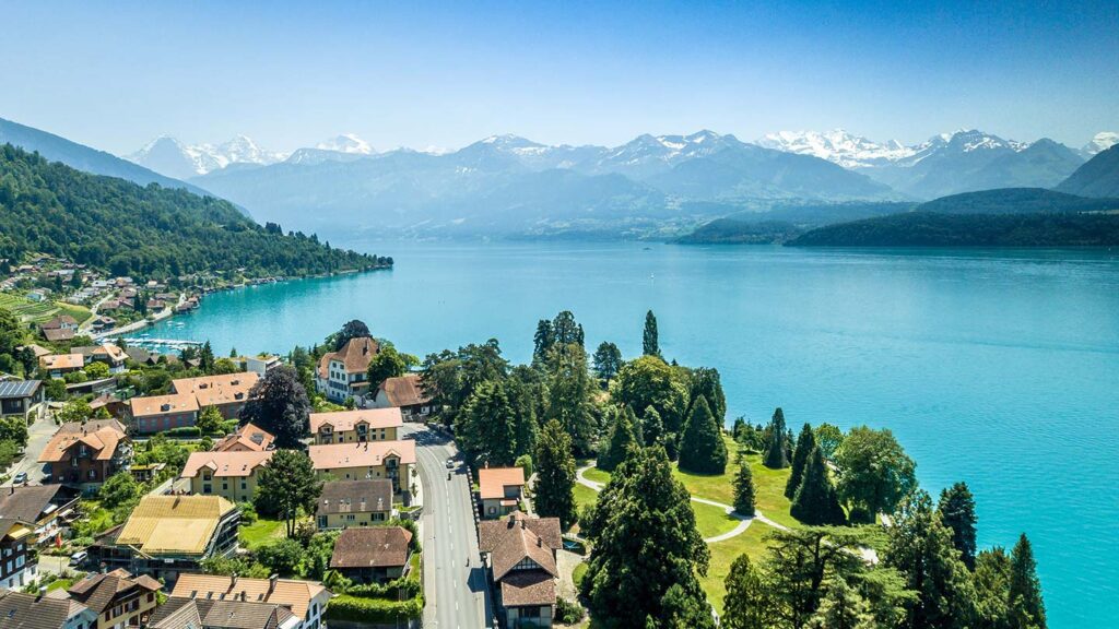 Aerial image of a village near Lavaux, looking towards the Swiss Alps across Lake Geneva