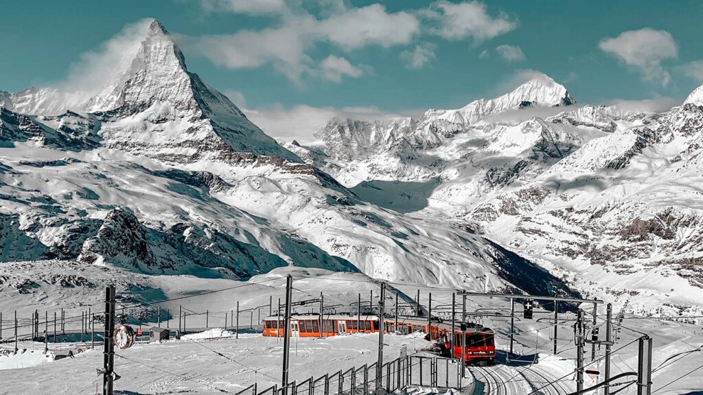 Image of the snow-covered Swiss Alps with the Matterhorn Gotthard railway in the foreground and the Matterhorn visible in the distance