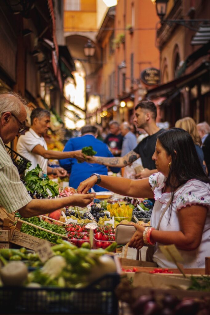 people shopping in open air markets bargaining tips