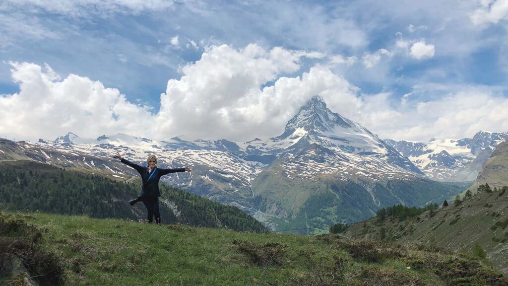 Ashlinn standing in front of a view of the Matterhorn in Switzerland
