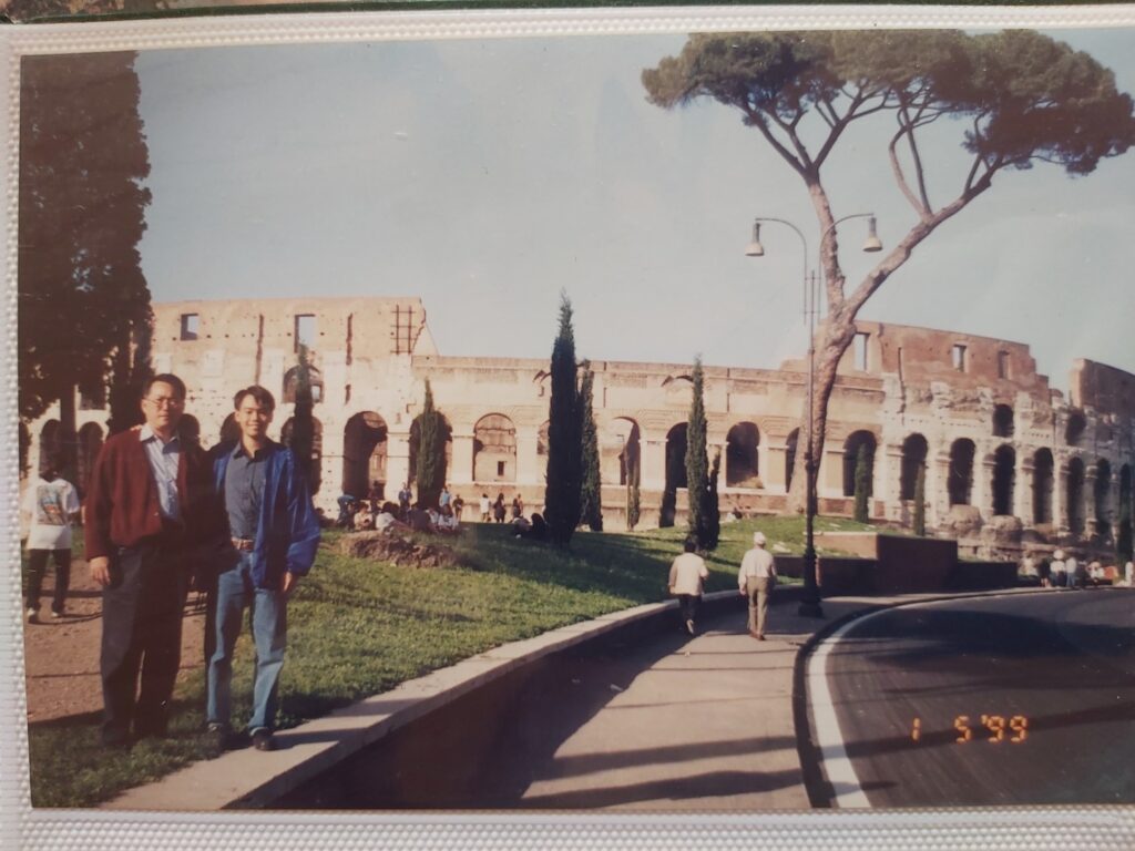Benedict and his dad at the Colosseum in Rome