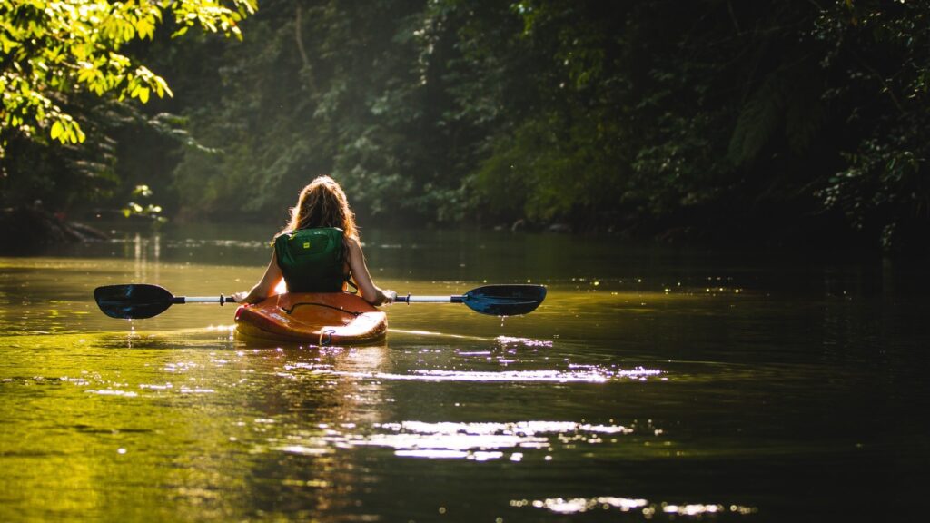 woman kayaking through waterways in Costa Rica