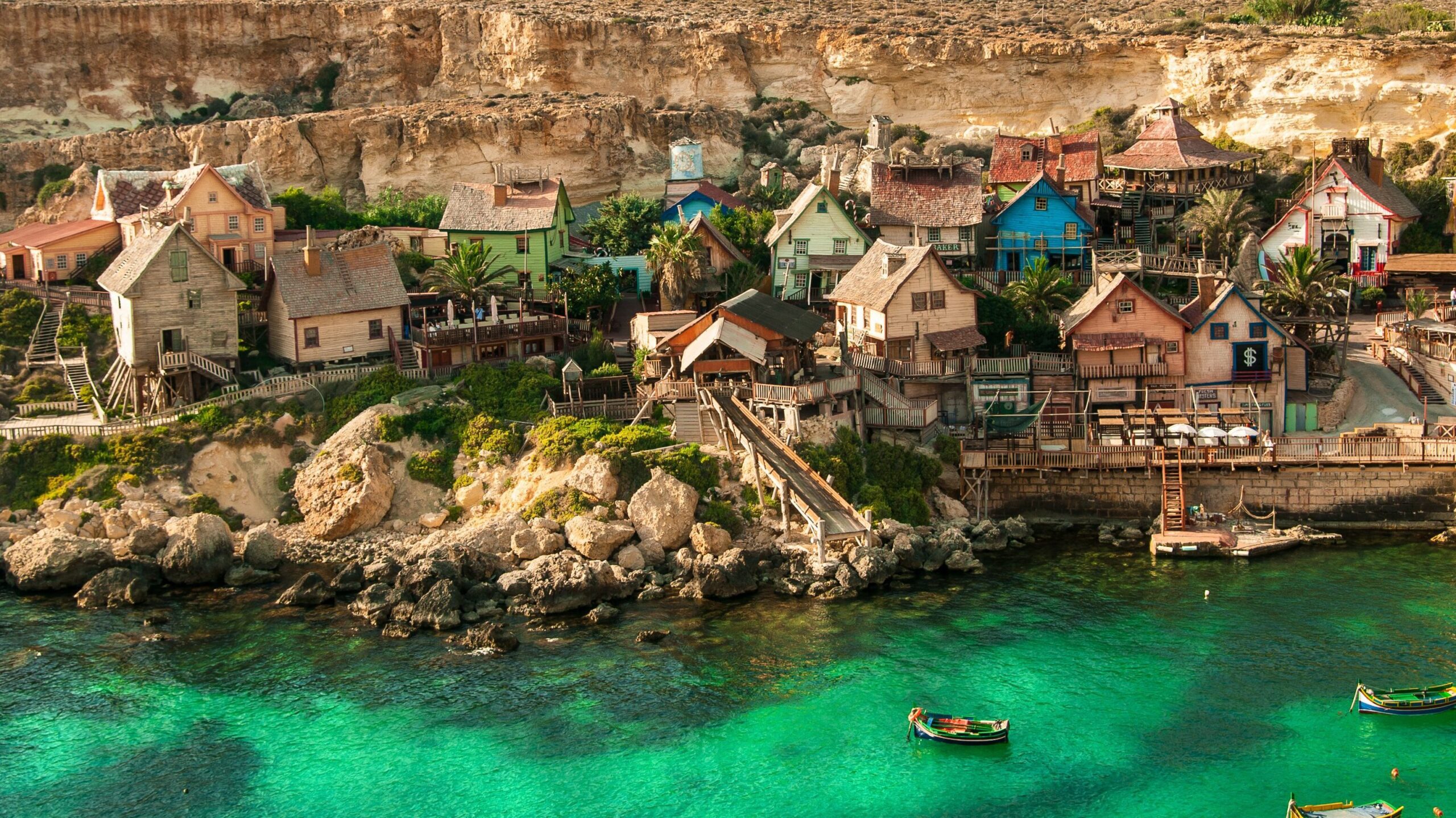 A village in Malta, with small characteristic houses located by turquoise waters. Malta has topped the ranking for being the world's most LGBTQ friendly places seven years in a row.