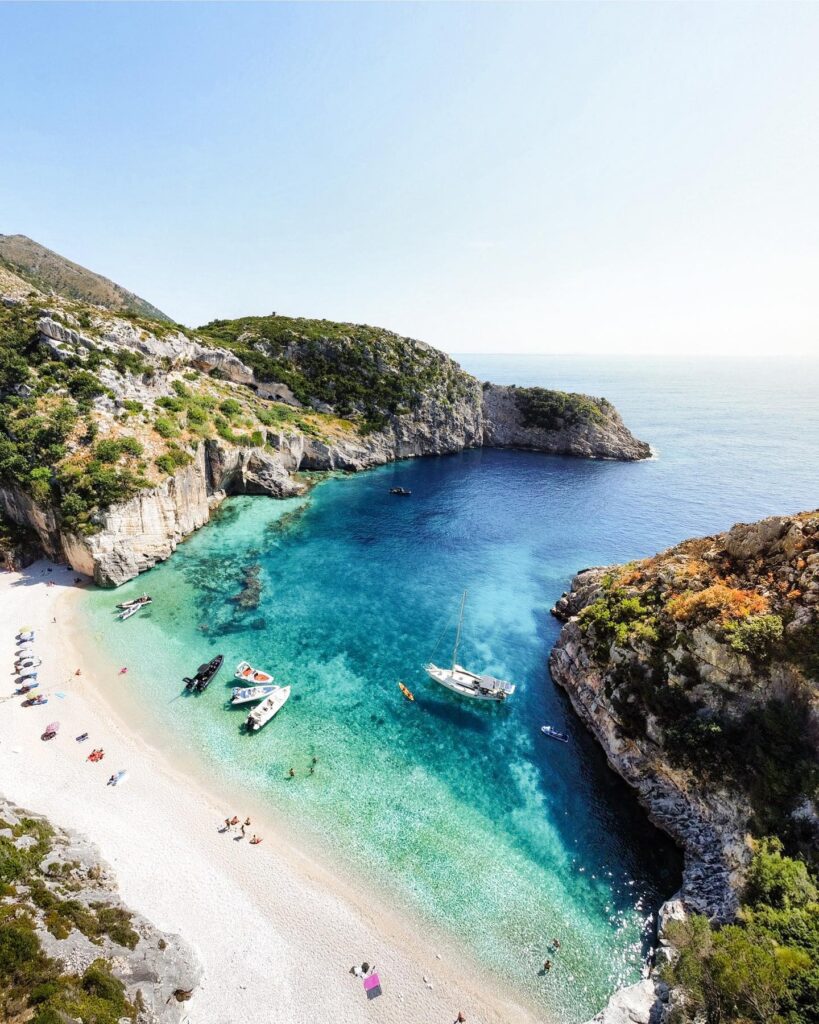 Grama bay is one of Albania's most beautiful beaches, with see-through waters, fantastic rock enclosures and bleach-white sands. This photo shows the beach from above.