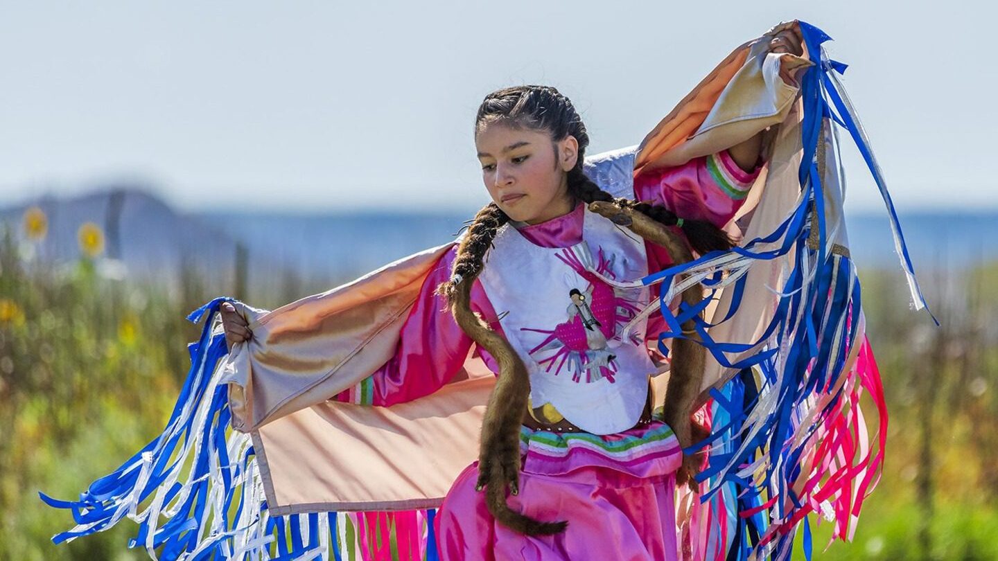 Native American girl in traditional regalia in the Dakotas