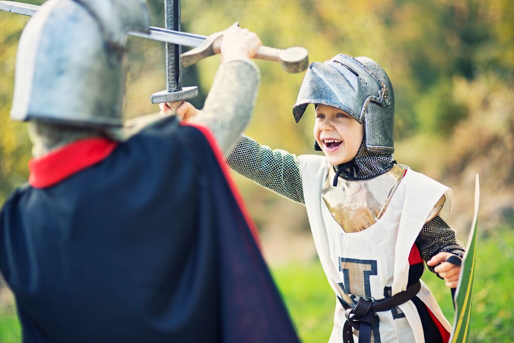 Children dressed up as knights playing