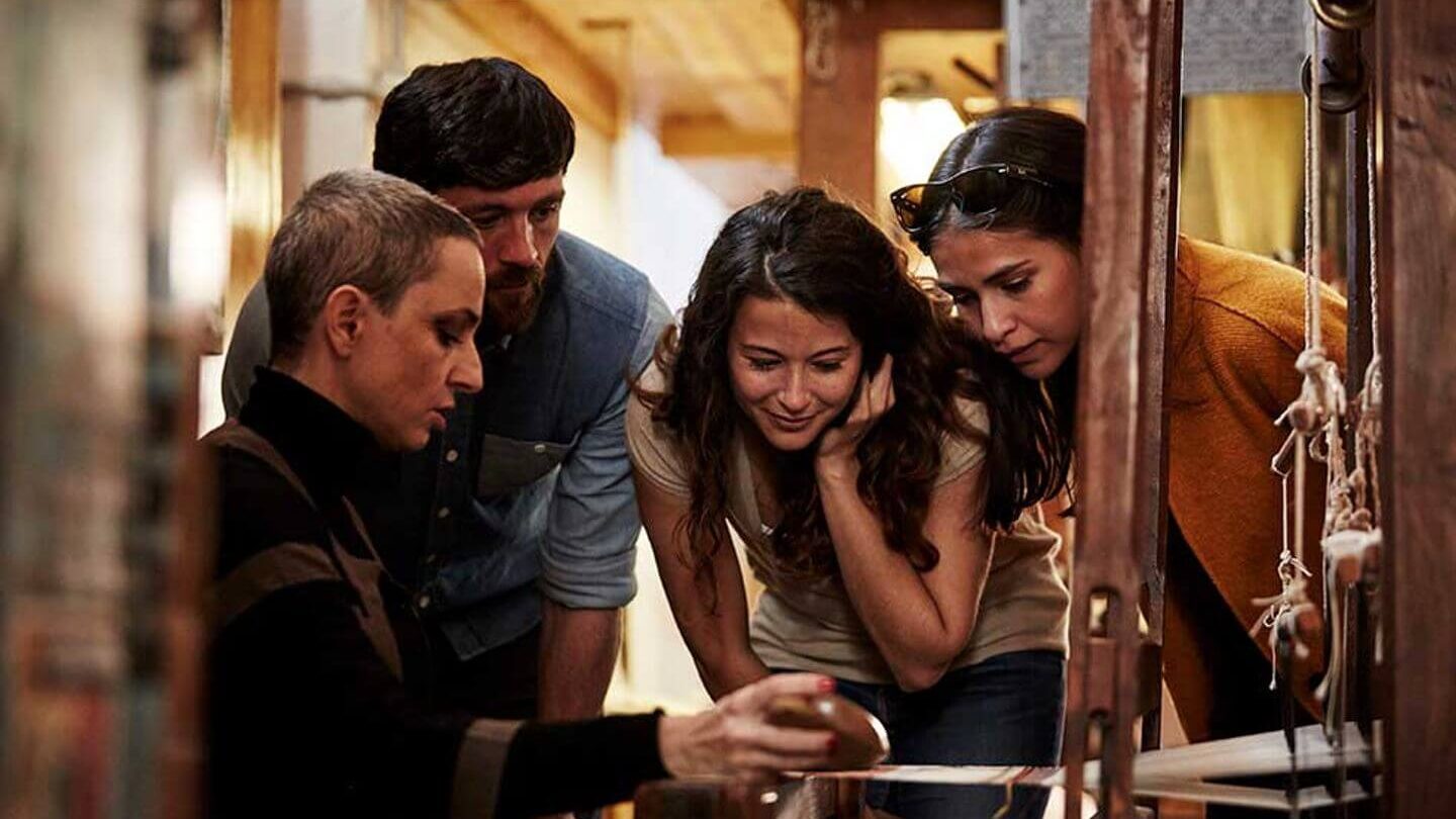 Martha Cucchia showing Trafalgar guests traditional weaving techniques in Perugia, Italy