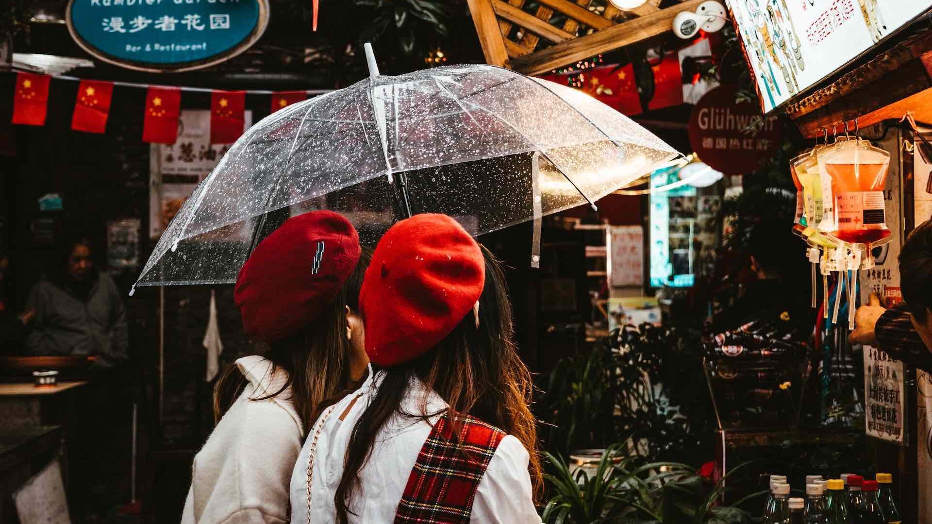 Two women with umbrella at Tianzifang night market, Shanghai