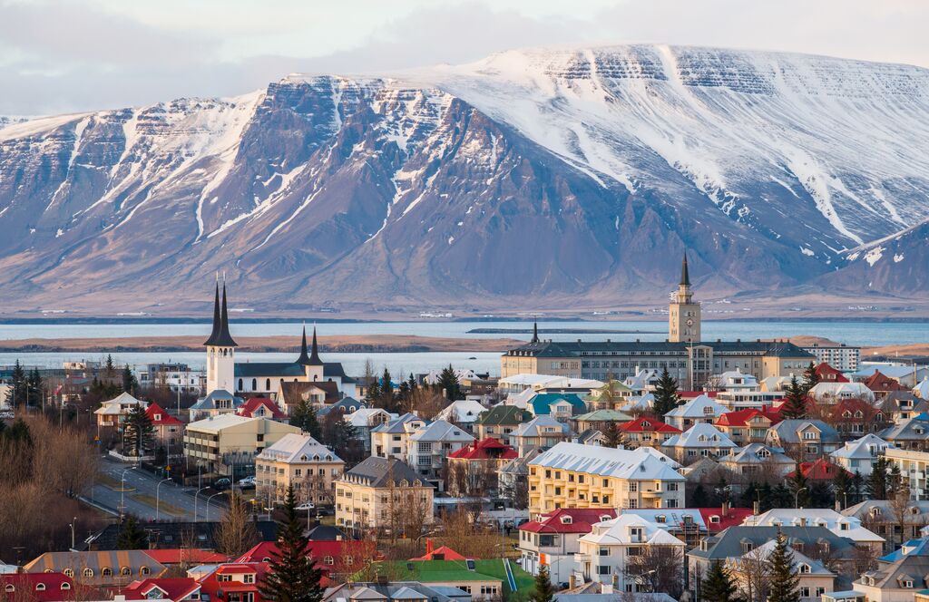 A view of an Icelandic mountain with Reykjavik in the foreground