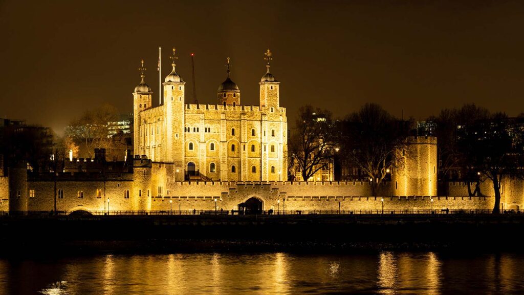 Castle-like building in London with fortress walls lining the front.