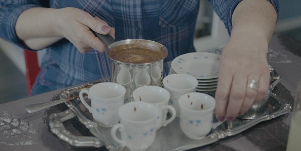 White coffee cups on a silver tray and a large put of coffee, a traditional in Sarajevo, Bosnia