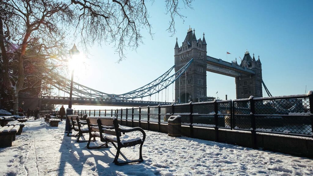 Tower bridge in the background as southbank in London is covered in snow.