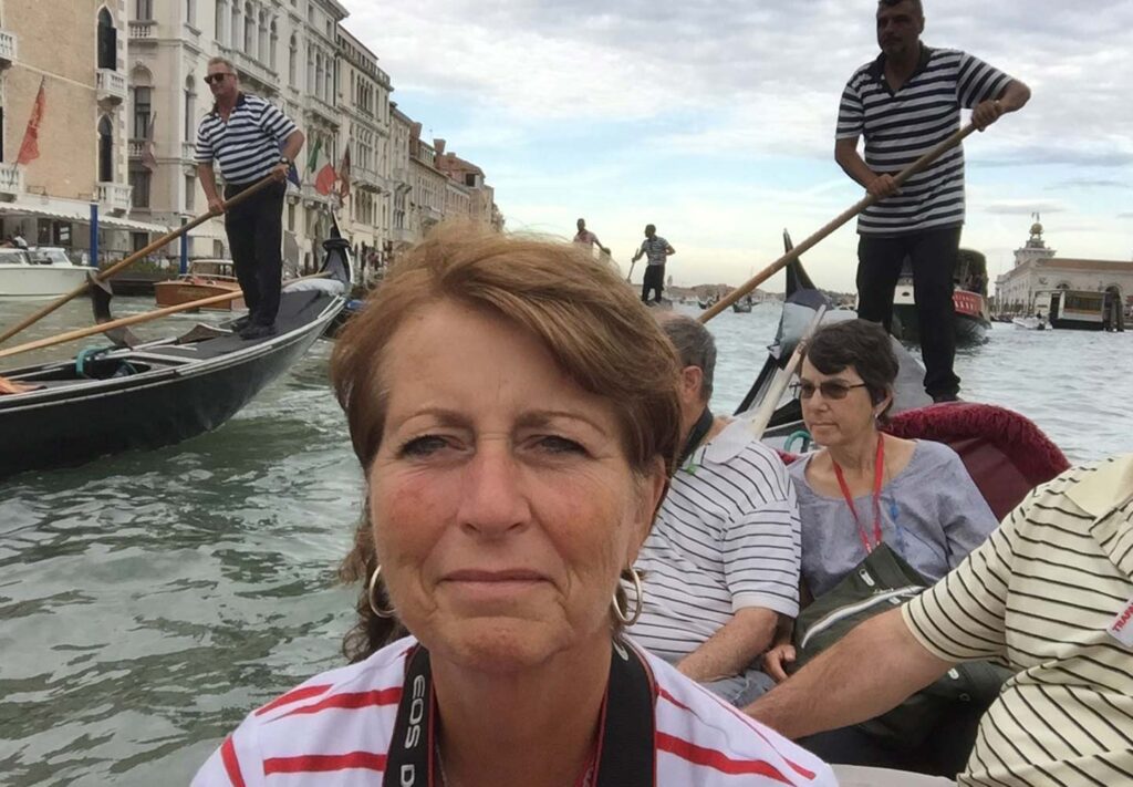 Trafalgar past guest Judith on a gondola in Italy