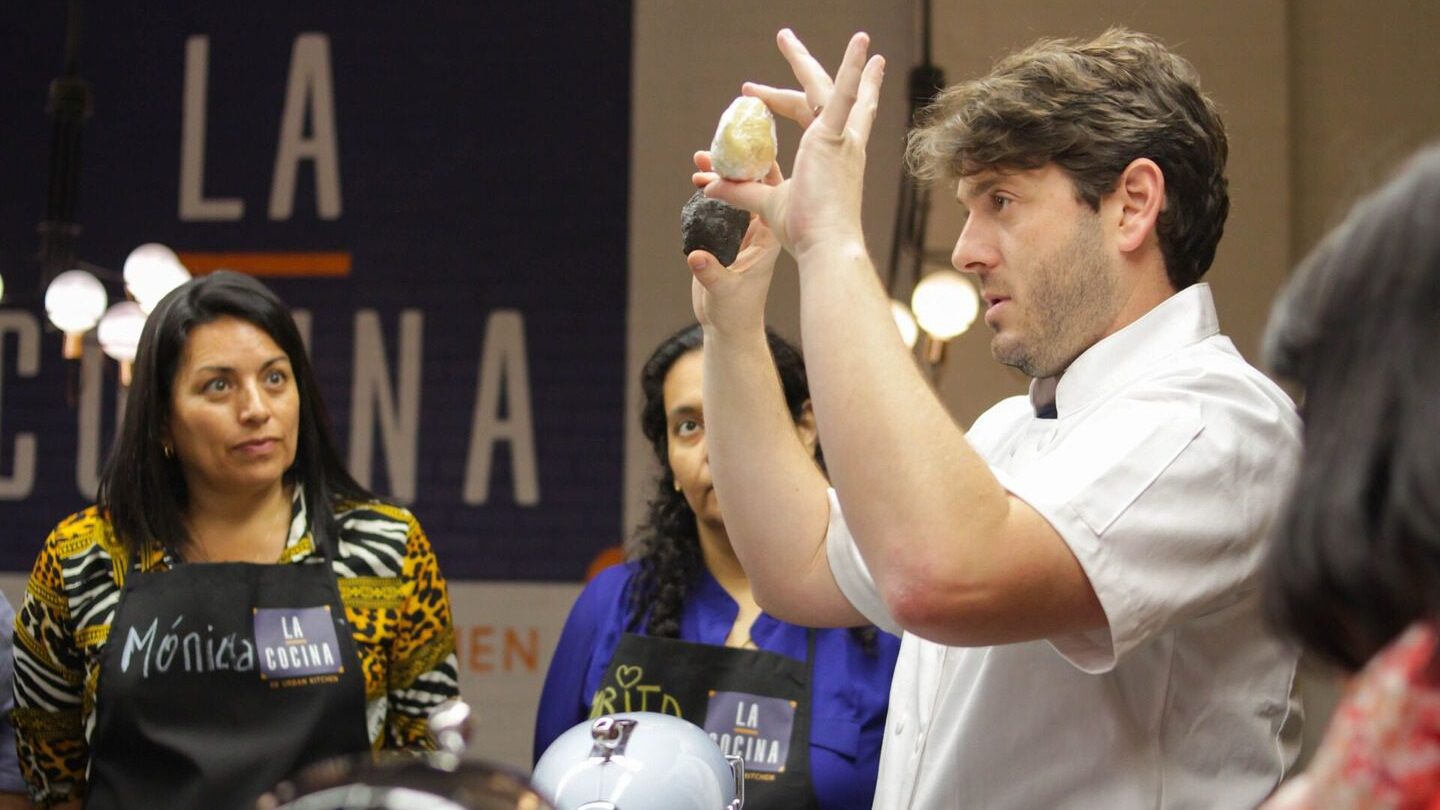 Chef Ignacio doing a cooking demonstration with Trafalgar guests